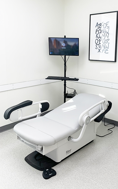 Photograph of a state-of-the-art, fully accessible phlebotomy bed (Midmark 626 Barrier-Free® Examination Chair)