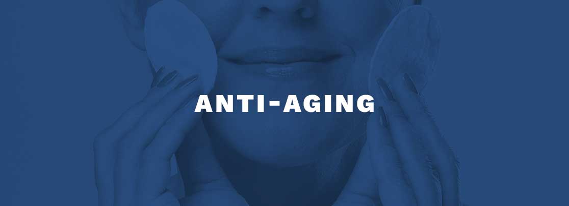 Photograph of a mature woman applying product to her face with header "ANTI-AGING"